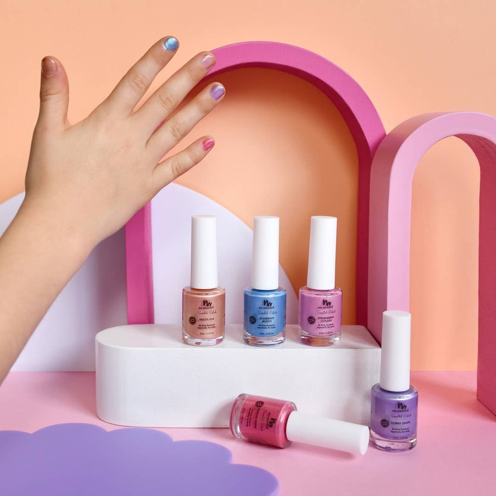 No Nasties Kids 20 Free water-based scented scratch-off nail polish set; six pastel bottles on a white podium