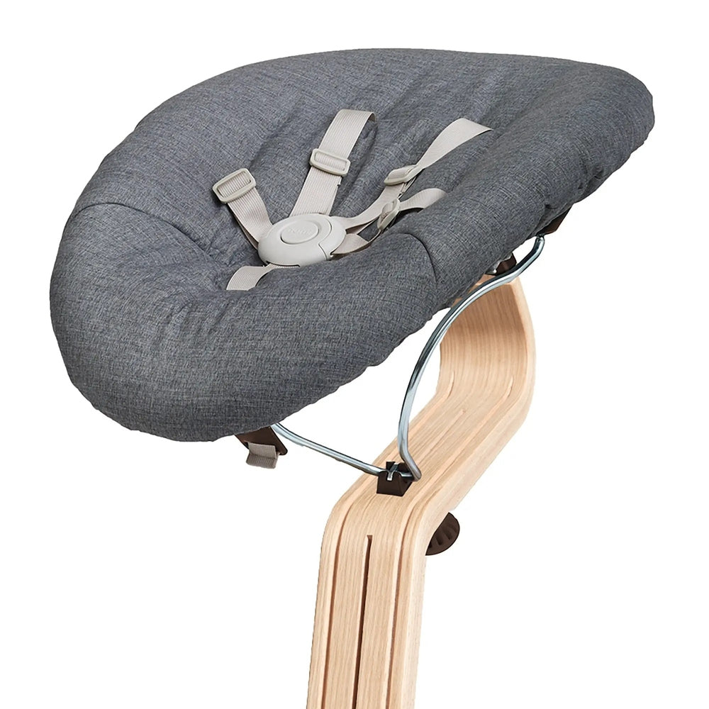 NOMI Baby cushioned high chair insert in gray fabric with beige harness buckled