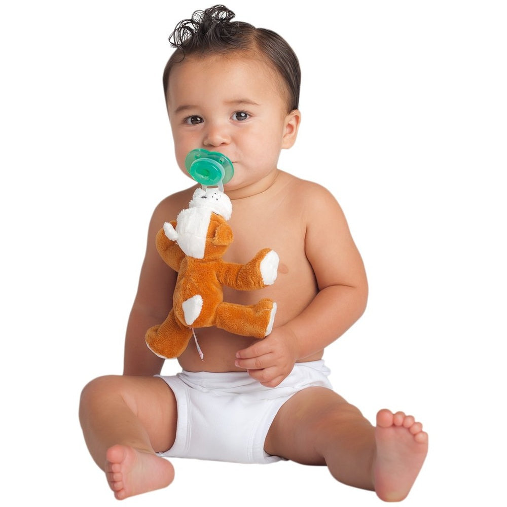 Nookums Paci-Plushies Barkley Bull Dog Shakies pacifier, baby sits in a diaper holding a plush bulldog and sucking on a green pacifier.