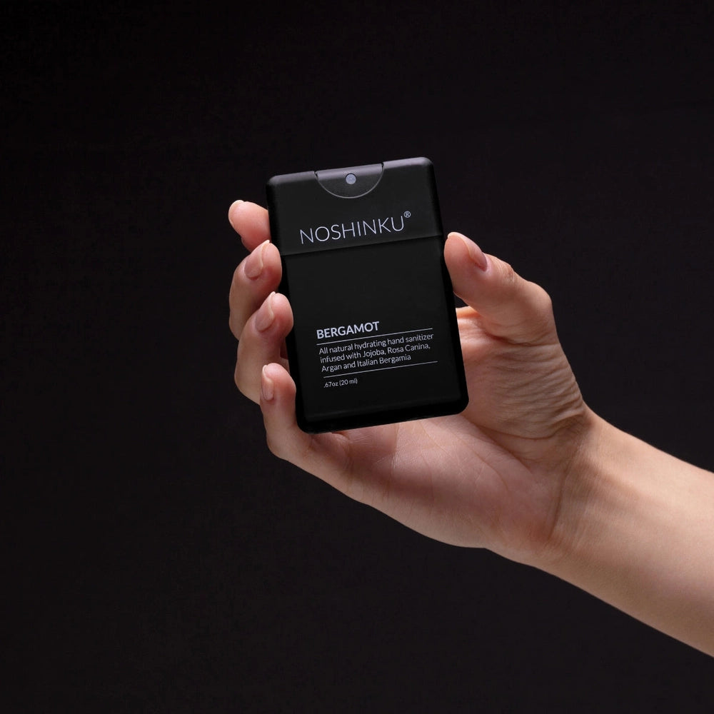 Noshinku Refillable Moisturizing Pocket Hand Sanitizer, black compact bottle with NOSHINKU branding