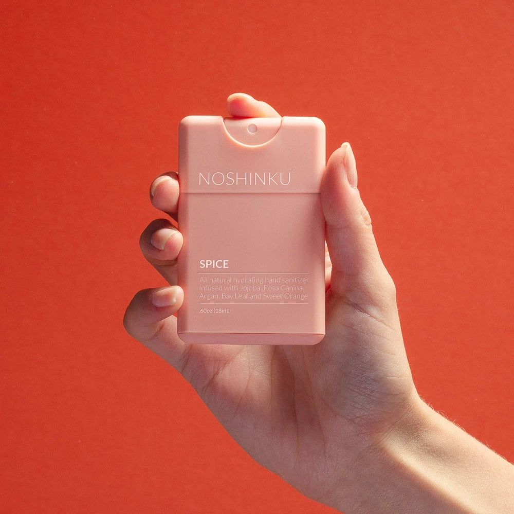 NOSHINKU pocket hand sanitizer in pink, Spice fragrance, refillable compact bottle