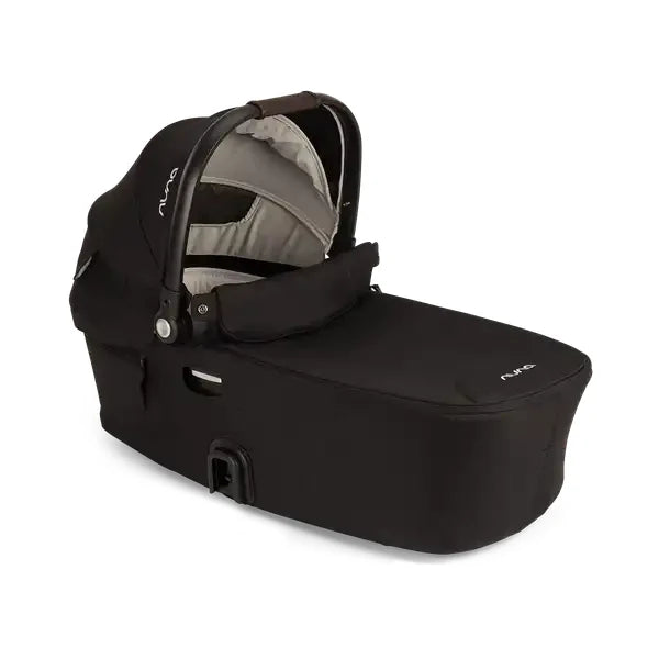 Nuna DEMI Next Bassinet showing in Caviar with canopy open and interior visible