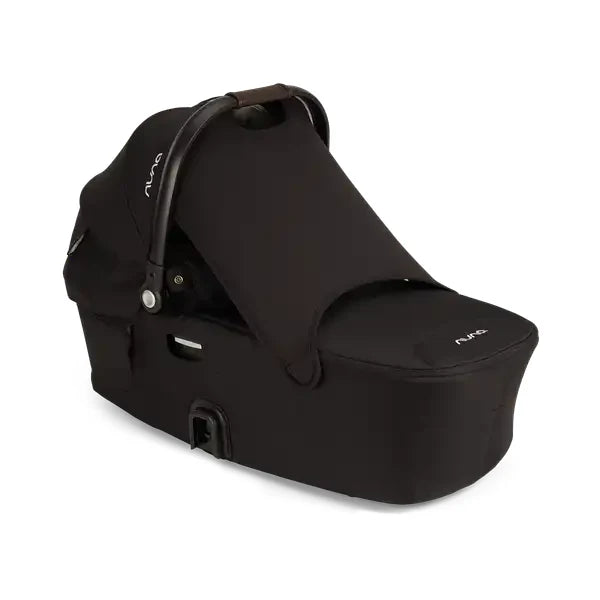 Nuna DEMI Next Bassinet showing in Caviar with protective drape extended