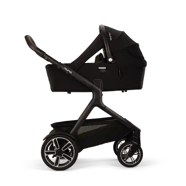 Nuna DEMI next Bassinet — Nuna DEMI next stroller side profile with Caviar bassinet canopy raised