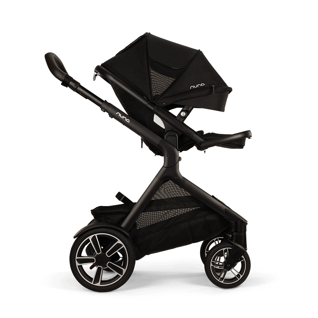 Nuna DEMI Next — Caviar — raised footrest world facing