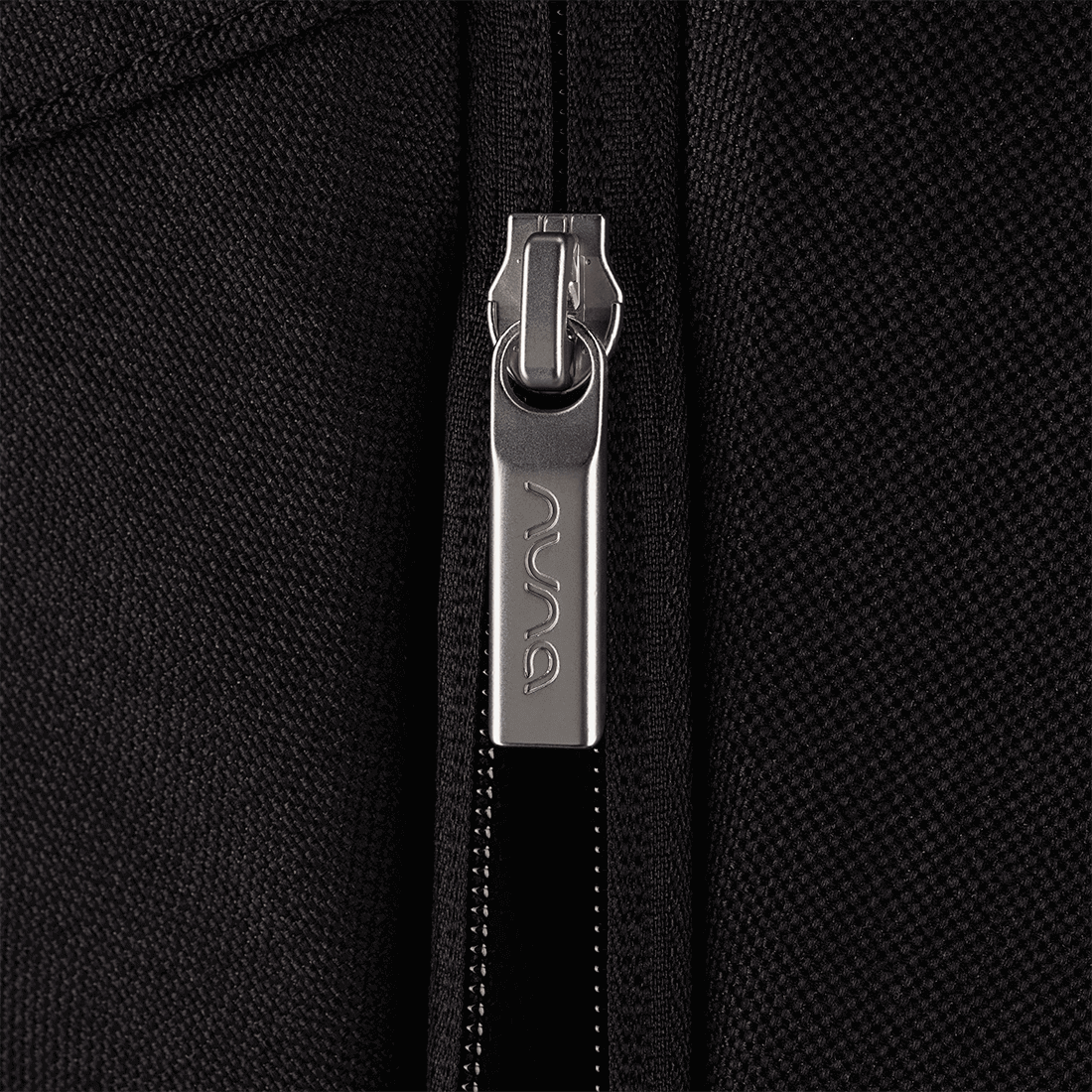 Nuna MIXX next Stroller — Nuna zipper pull close-up on black fabric