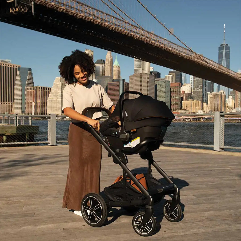Nuna MIXX Next Stroller + PIPA Urbn Infant Car Seat Travel System showing in-use view