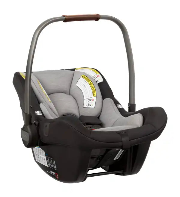 Nuna PIPA lite Infant Car Seat in Caviar - front three-quarter view with handle raised