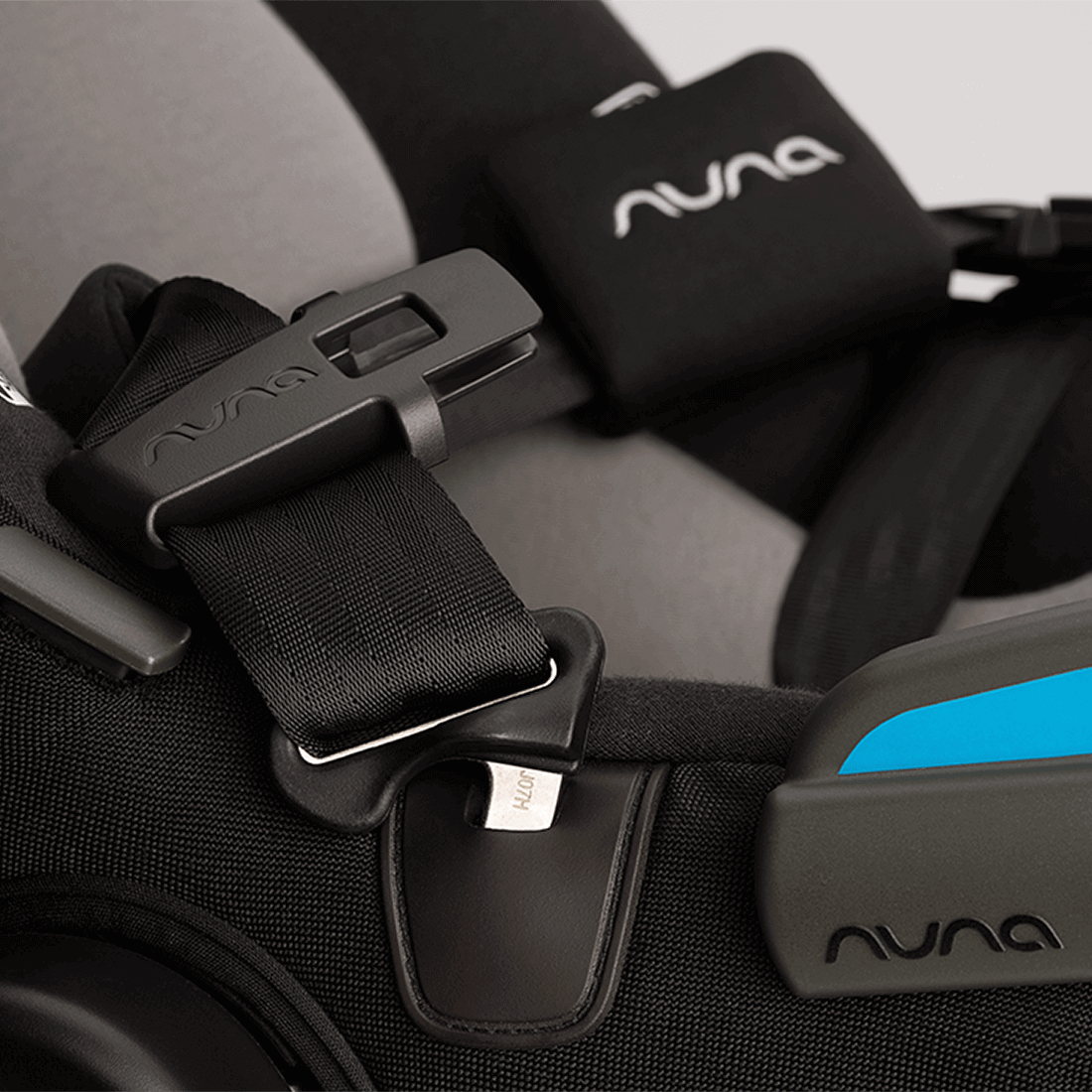 Nuna TAVO next PIPA Travel System — stroller buckle and harness close-up