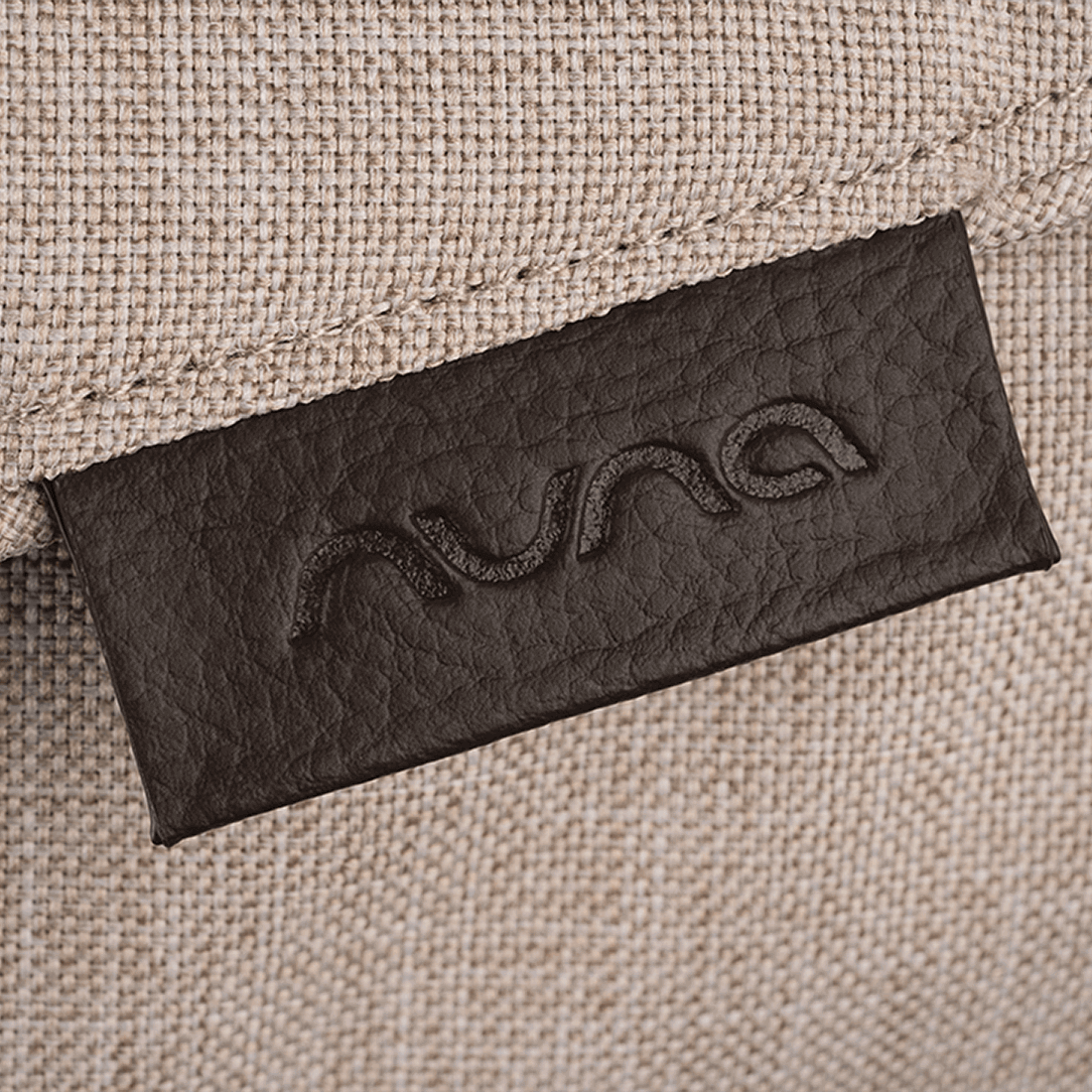Nuna TRIV next Stroller — Biscotti fabric and Nuna logo tab detail