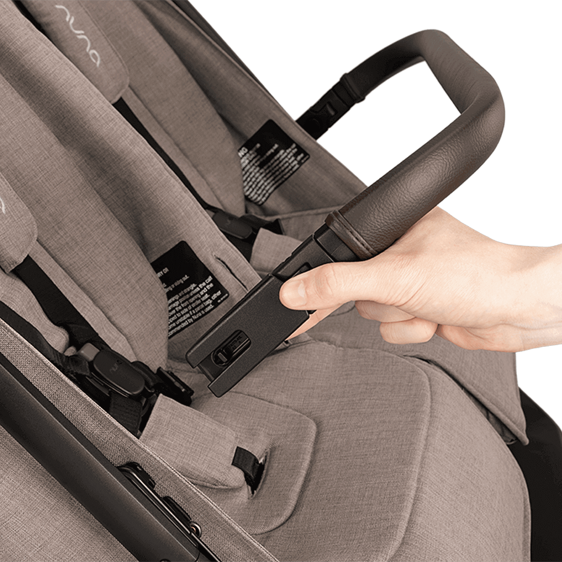 Nuna TRVL dubl Stroller — Cedar rotating armbar release close-up