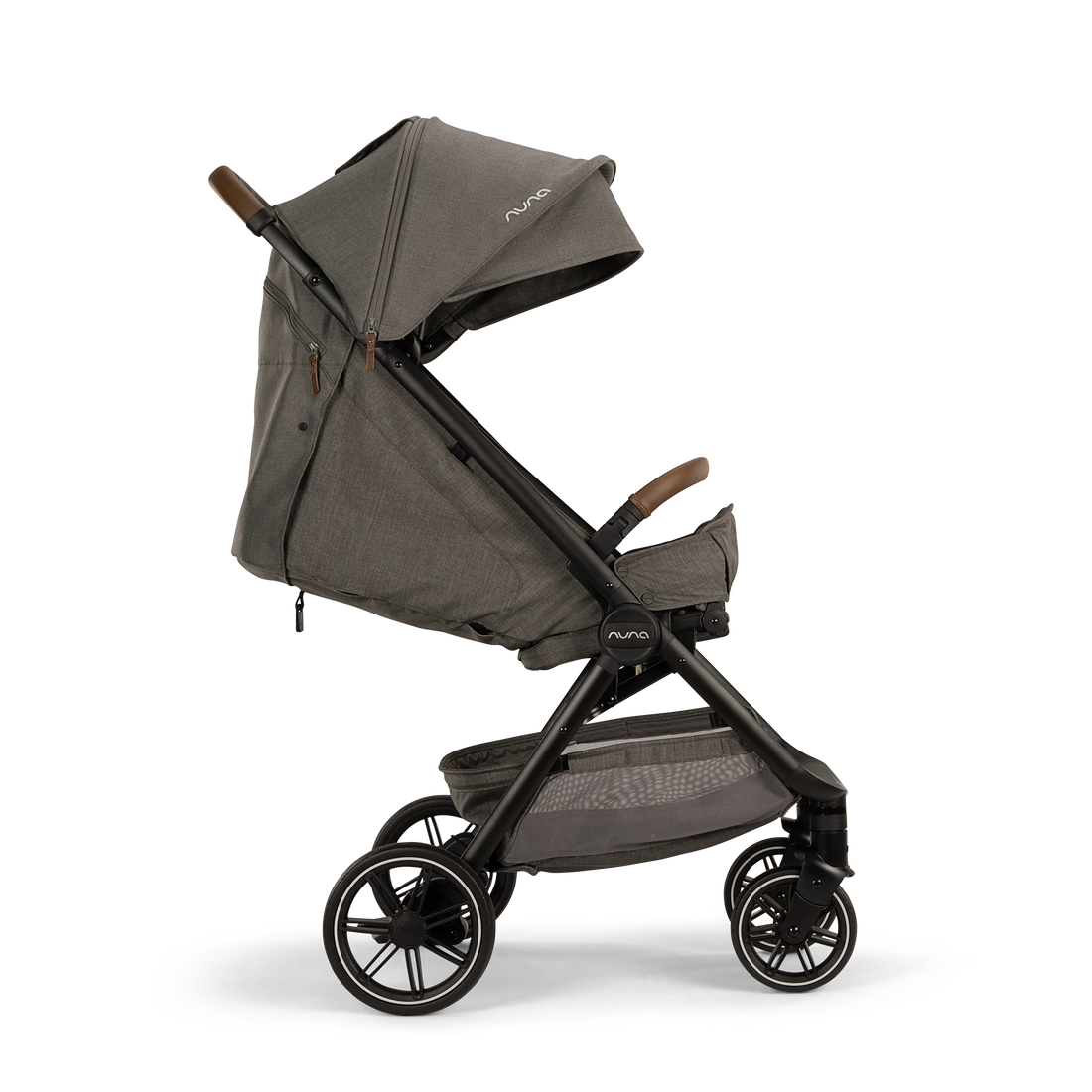 Nuna TRVL LX stroller in Granite, side profile with reclined seat and raised calf support
