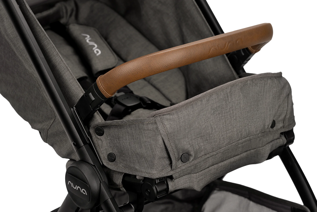 Nuna TRVL LX stroller in Granite, leatherette armbar and raised calf support detail