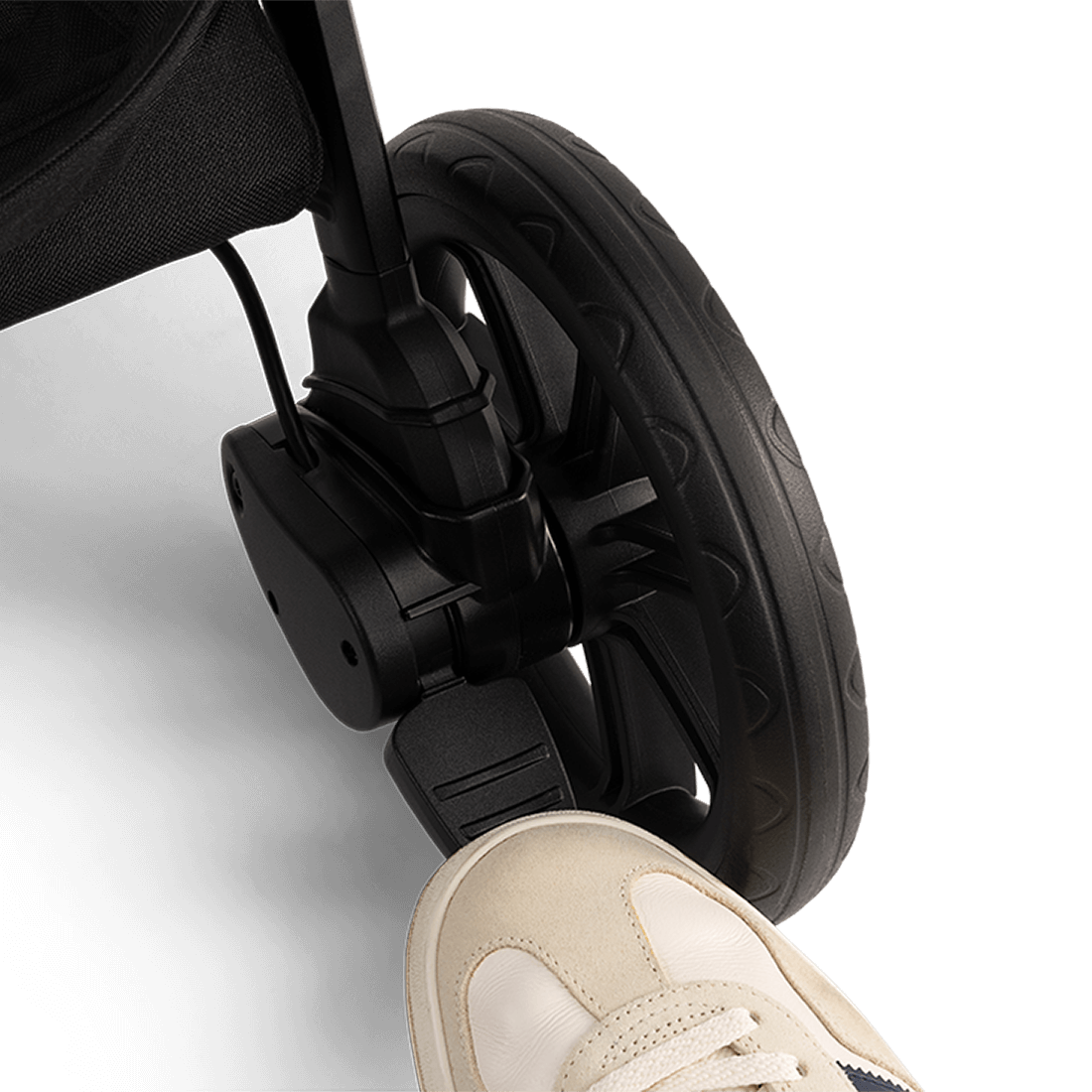 Nuna TRVL lx Stroller — Caviar brake pedal from alternate angle