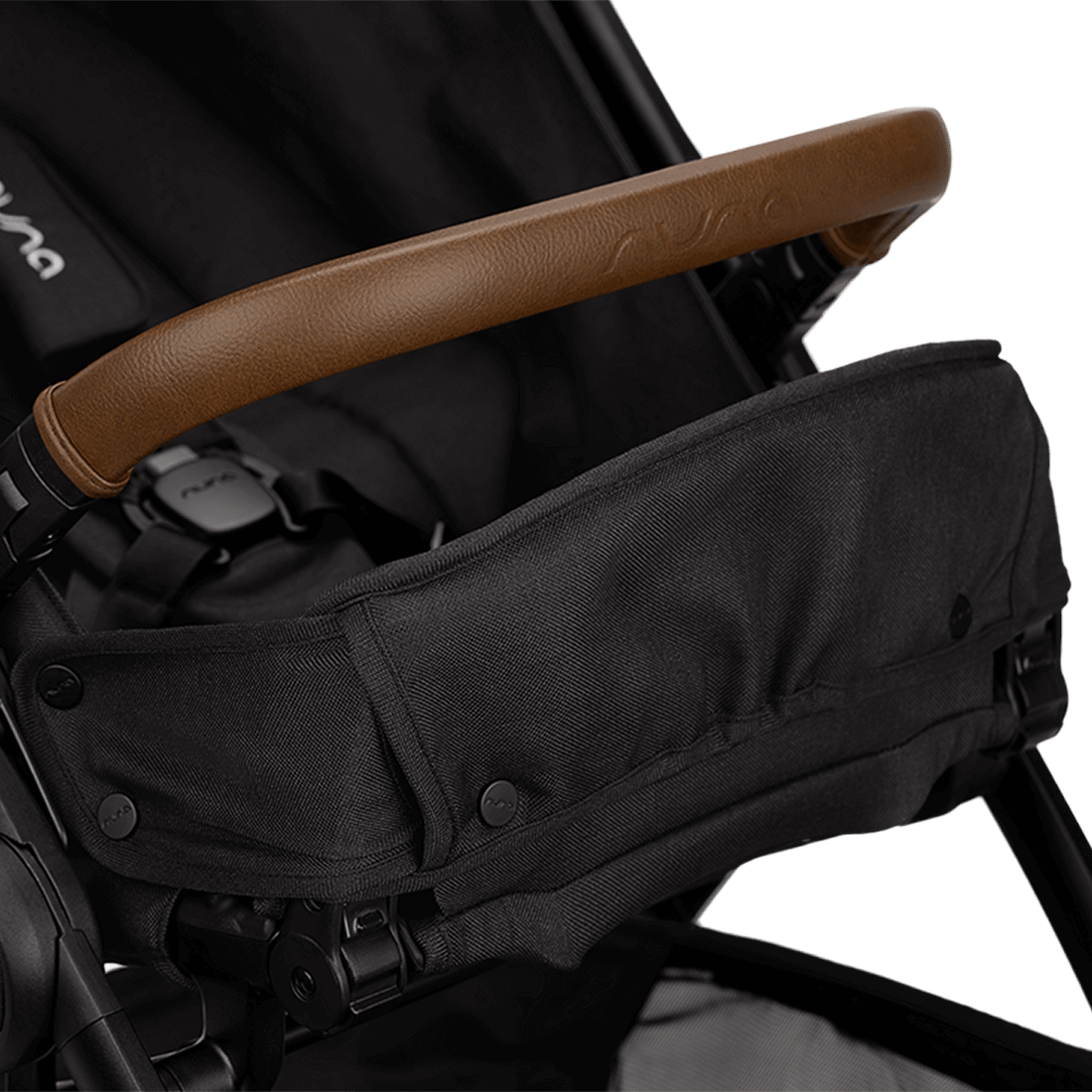 Nuna TRVL lx Stroller — Caviar child restraint and armbar view