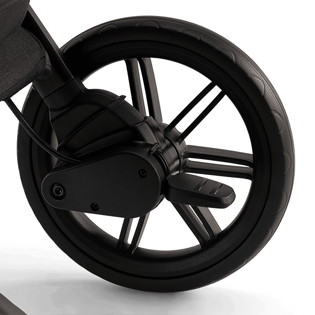 Nuna TRVL lx Stroller — Caviar rear-wheel brake close-up