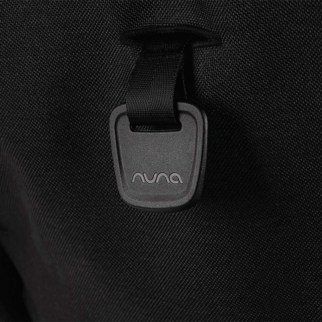 Nuna TRVL lx Stroller — Caviar recline adjustment tab