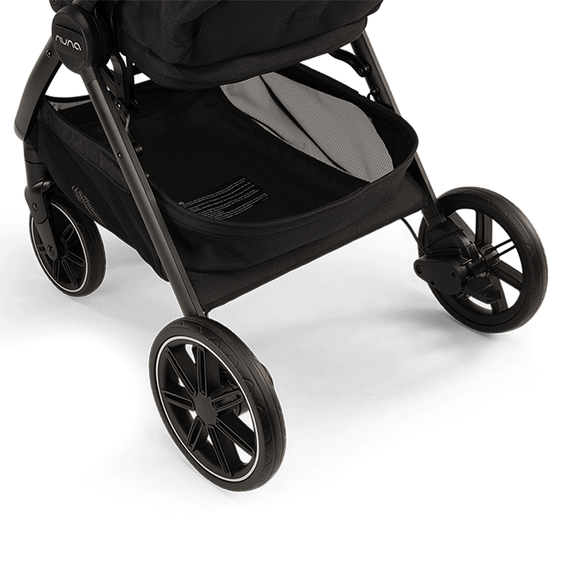 Nuna TRVL lx Stroller — Caviar underseat basket and rear wheels