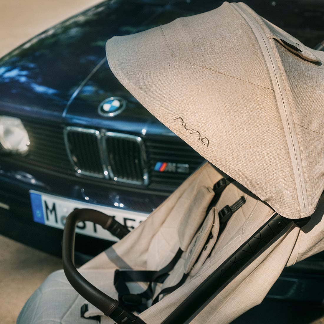 Nuna TRVL lx Stroller — Mica BMW canopy branding close-up