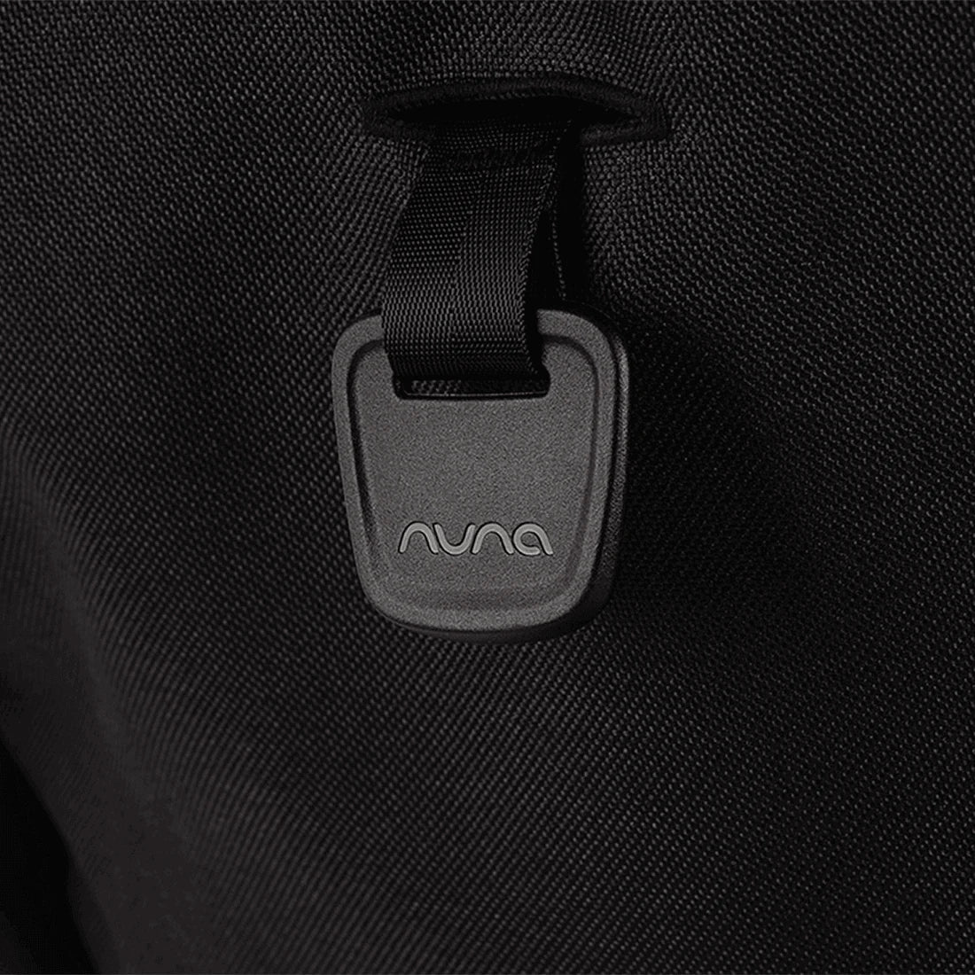 Nuna TRVL LX Stroller + PIPA Urbn Infant Car Seat Travel System showing Nuna TRVL lx Stroller — Caviar recline adjustment tab