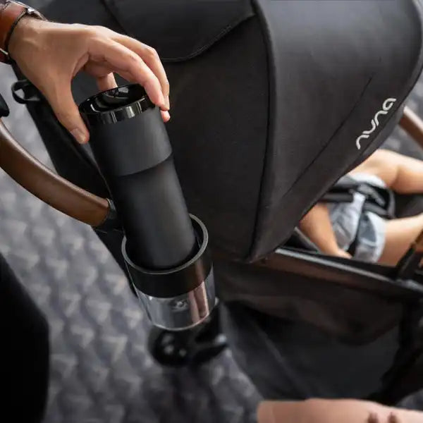 Nuna TRVL Series Cup Holder attached to a stroller