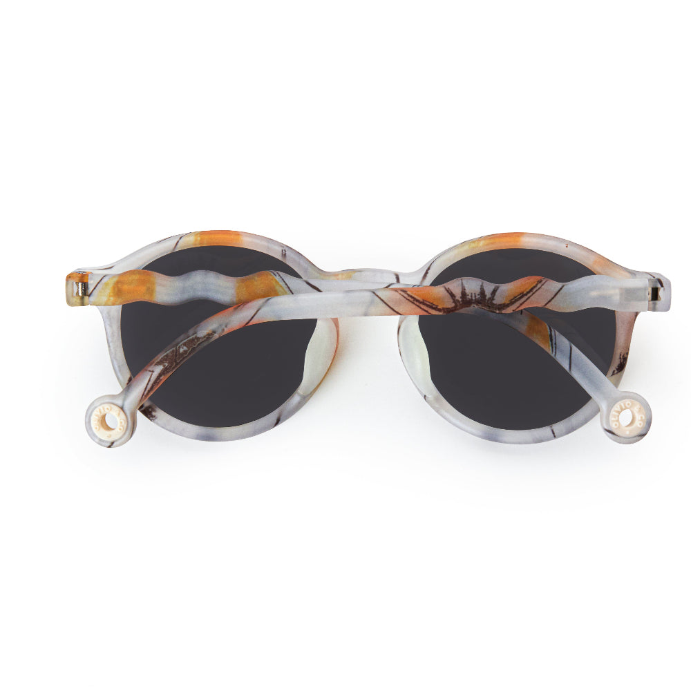 Olivio & Co junior oval sunglasses in marbled Morning Dawnlight frame with dark lenses
