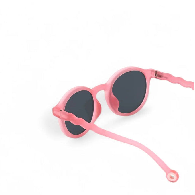 Olivio & Co oval sunglasses for juniors in rock rose pink with dark lenses and wavy arms