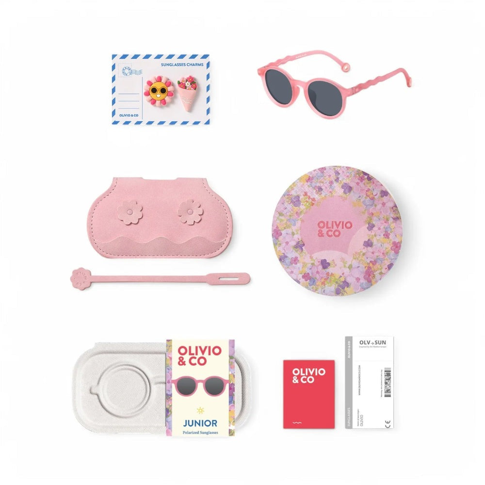 Olivio & Co junior pink Rock Rose oval sunglasses set with floral accents, includes matching case, wand, and round tin