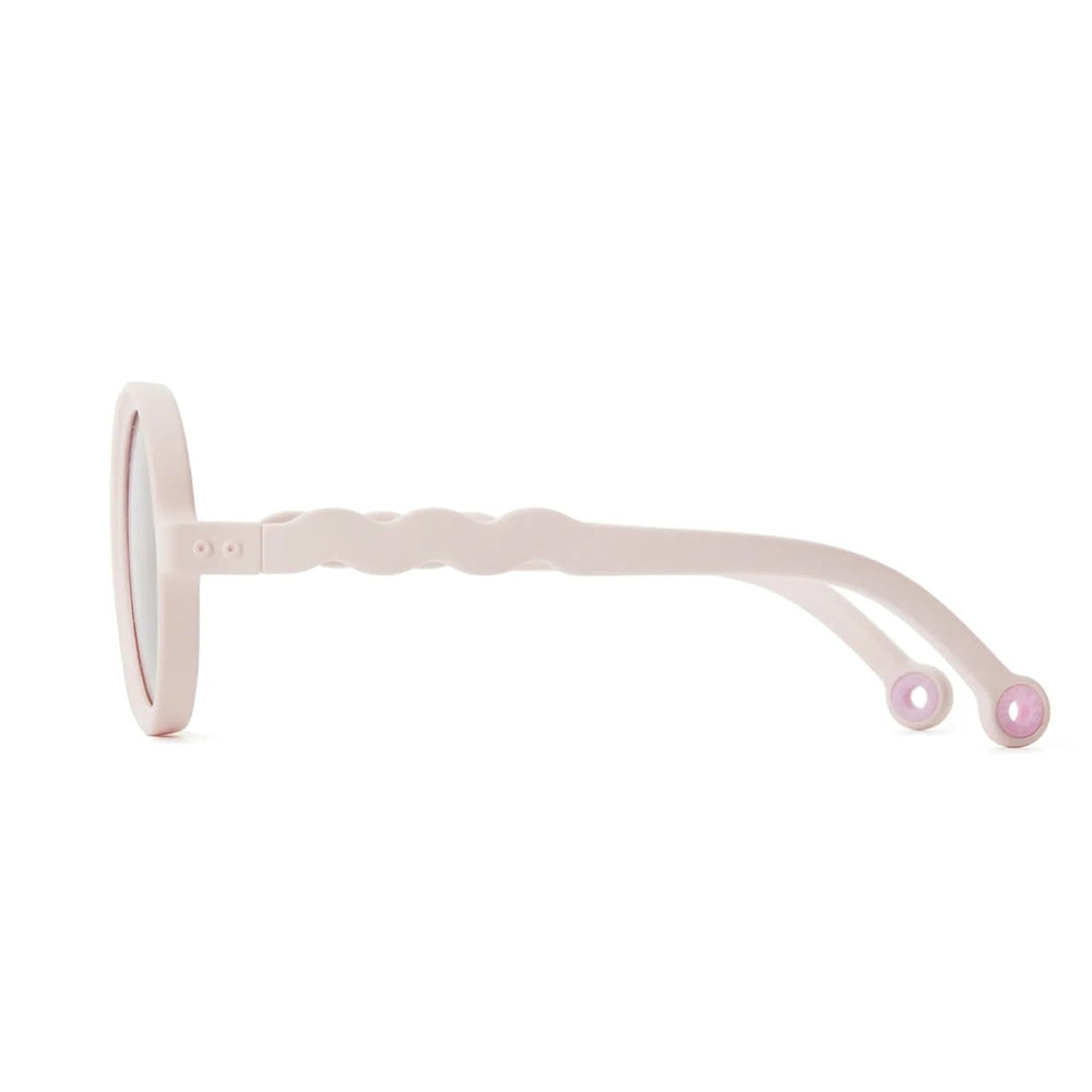 Olivio & Co Round Sunglasses Kids Coral Reef Coral Blush, side view showing wavy arms and pink temple tips