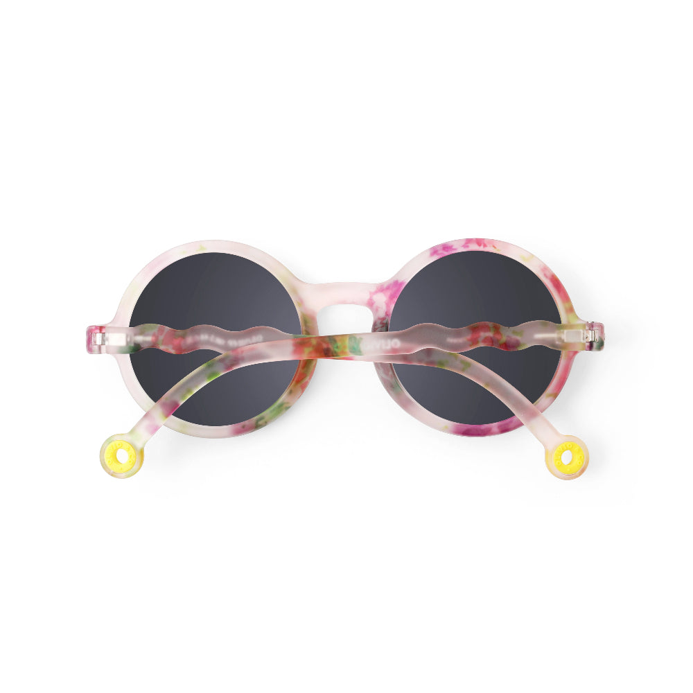 OLIVIO & CO Round Sunglasses for kids in pink Wild Flower pattern, round dark lenses with yellow end tips visible.