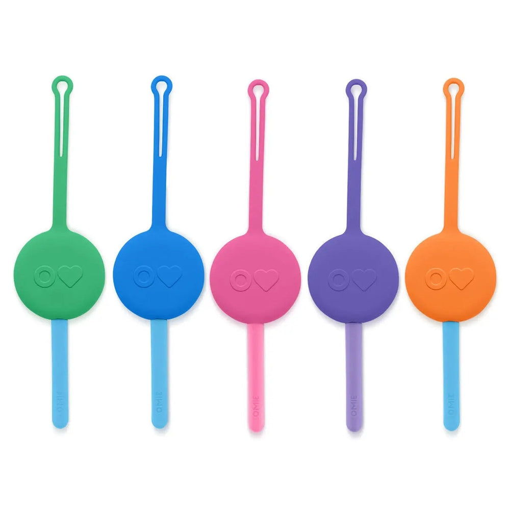 Omielife Fork Spoon Pod Set, five colorful silicone utensils with looped handles, laid out for easy lunch prep.