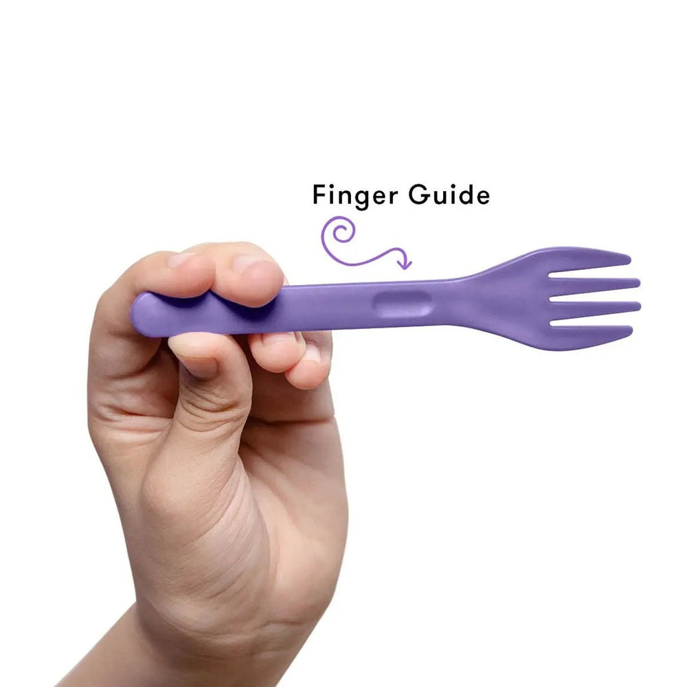 Omielife Fork Spoon Pod Set in purple, held to show finger grip for easy toddler feeding.