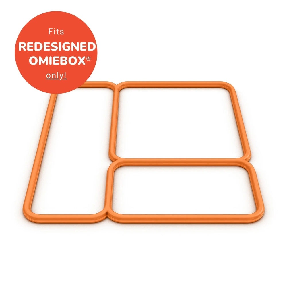 Omielife Lid Seal Version 2 orange silicone frame clamped around a lunch box edge for a mess-free seal.