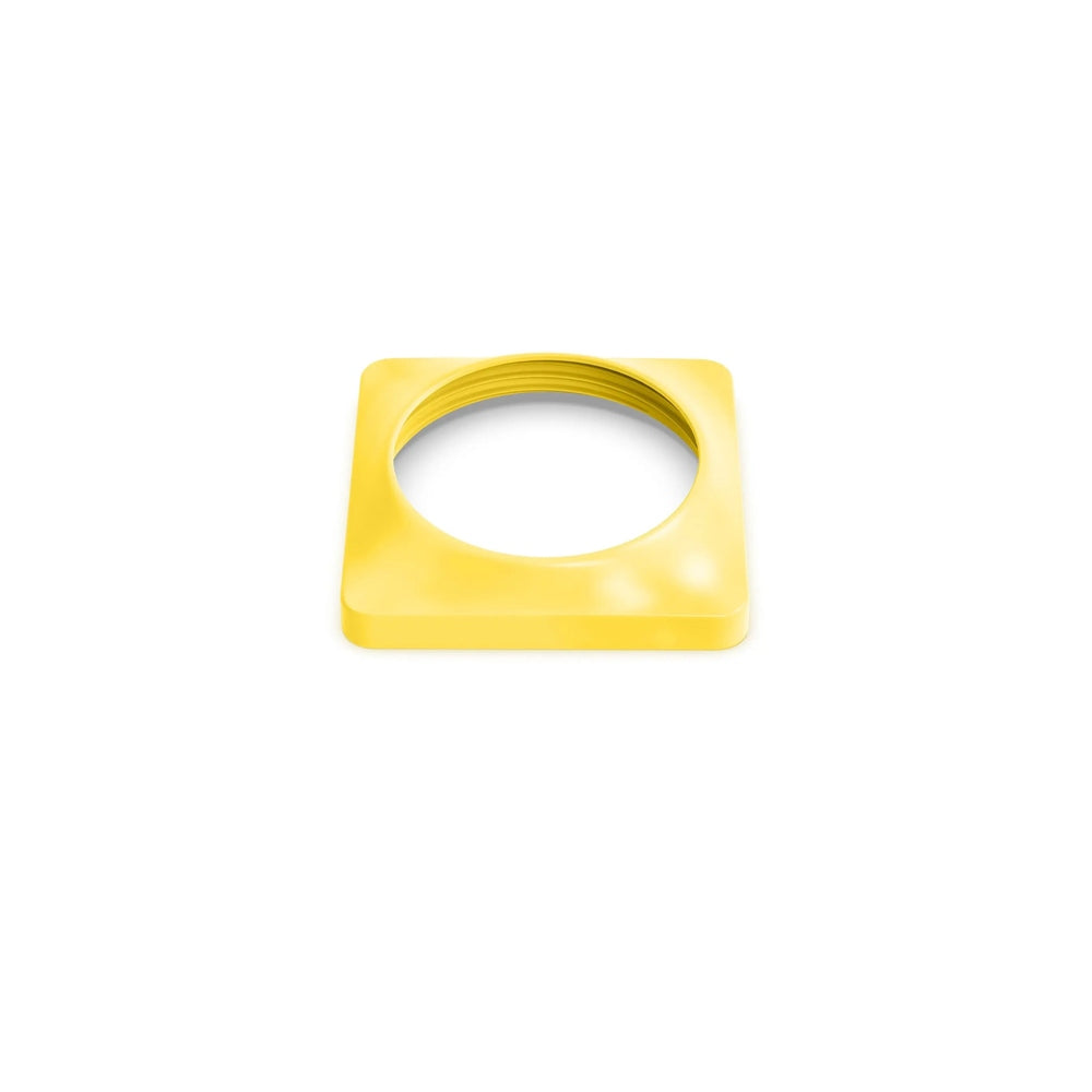 Omielife Omiebox Securing Insert Version 2 in bright yellow; square plastic ring surrounding a round opening.