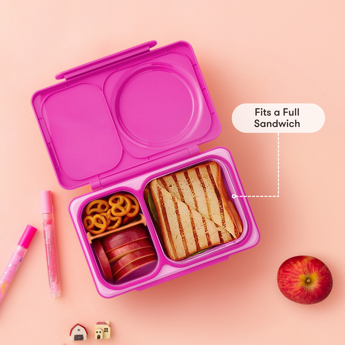 OmieBox UP Pop Pink open with a full sandwich, pretzels and apple slices