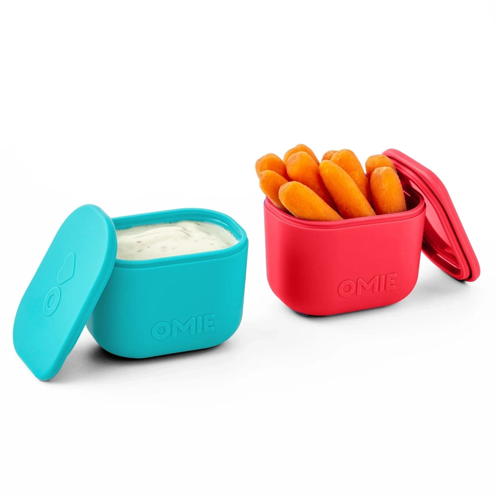 Omielife Omiebox Up Dip Sets in turquoise and pink with lids; turquoise sauce cup and pink snack cup with orange bites.