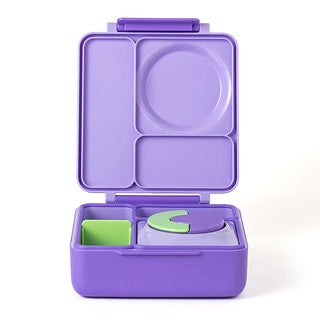 Omielife Omiebox Version 2 lunch container, purple, open with multi-compartment tray and green spoon.