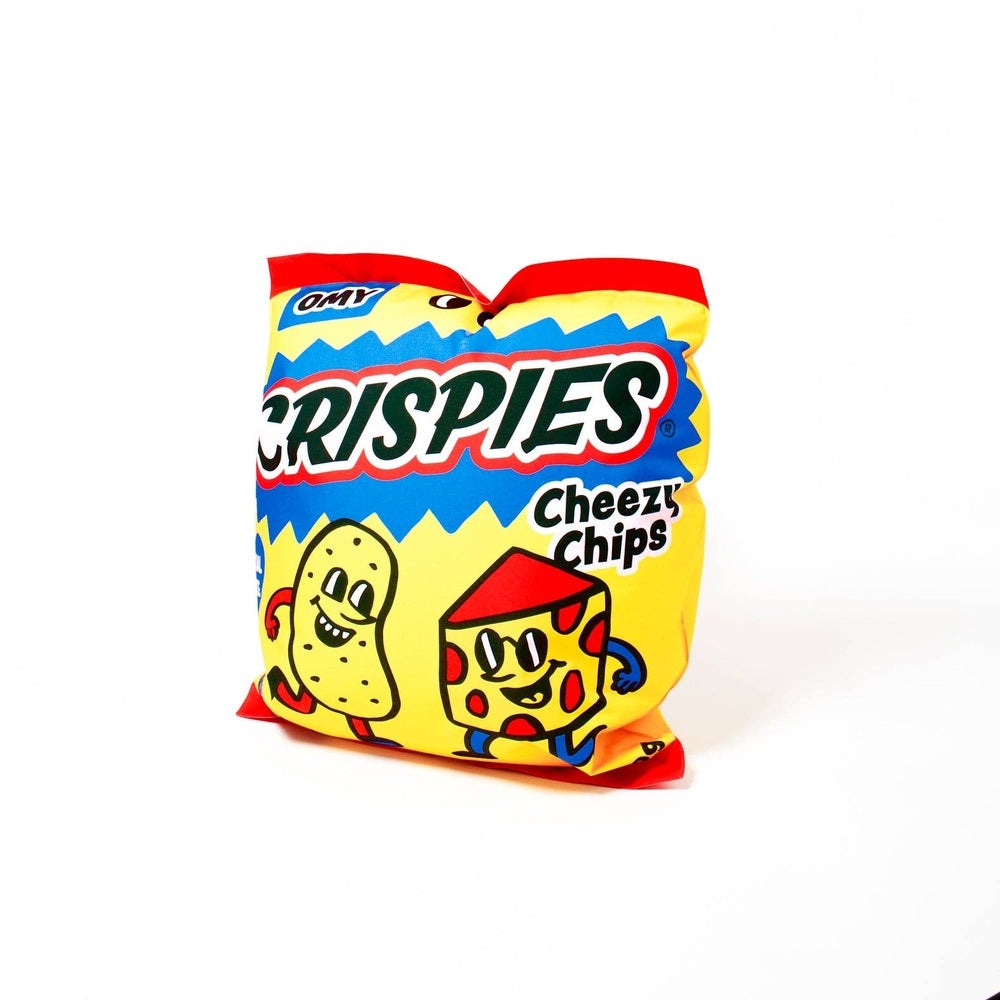 OMY Crispies Giant inflatable pillow package, bright yellow with red trim, cartoon cheese and cracker characters.