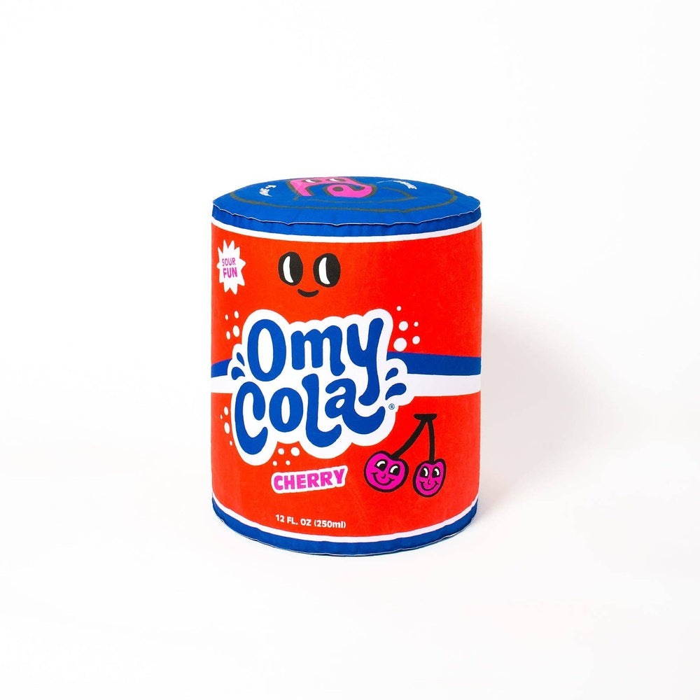 OMY Cola giant inflatable pillow shaped like a red cola can with blue trim and cherry graphics.