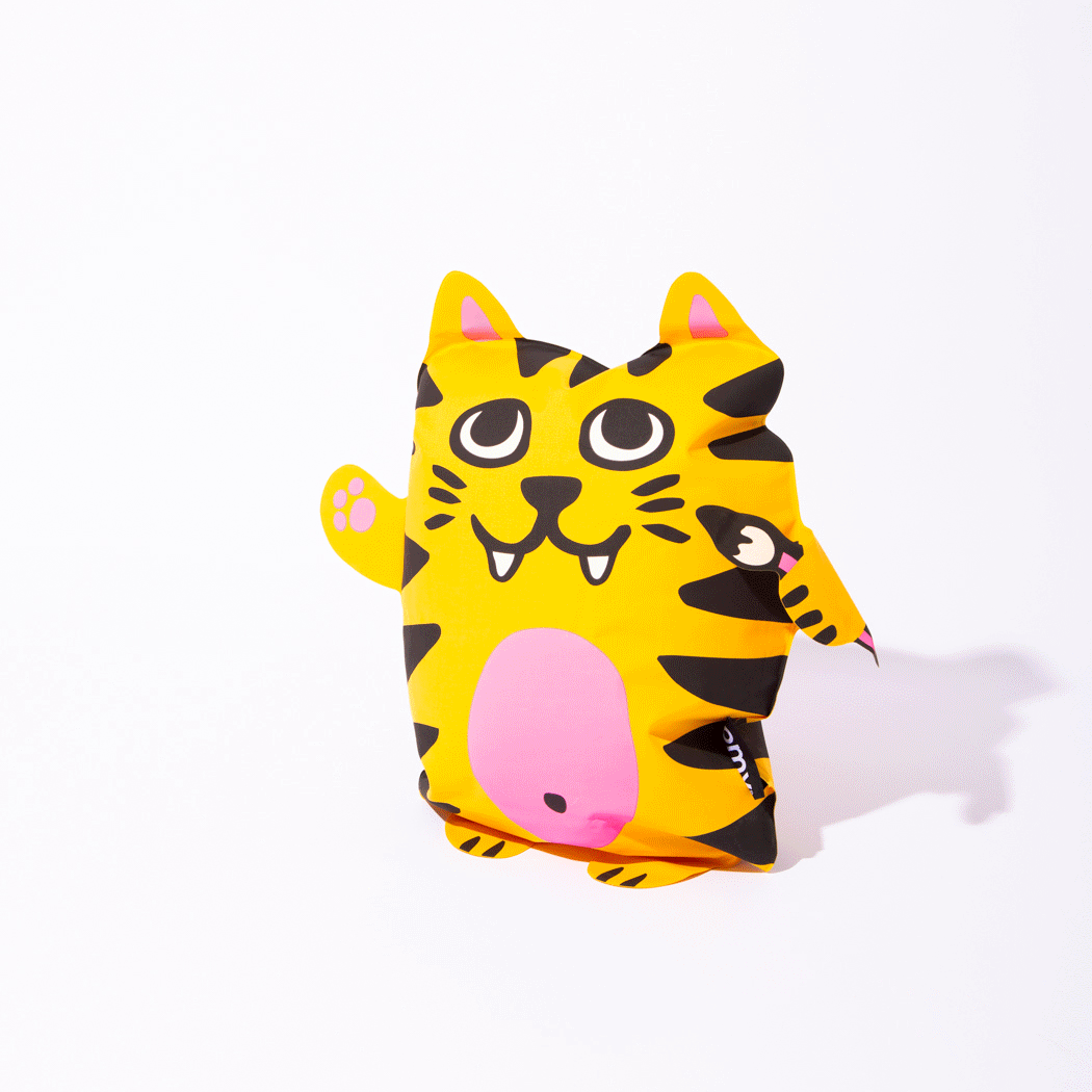OMY Tiga Super inflatable pillow, bright yellow tiger with pink belly, standing upright for playful party decor.