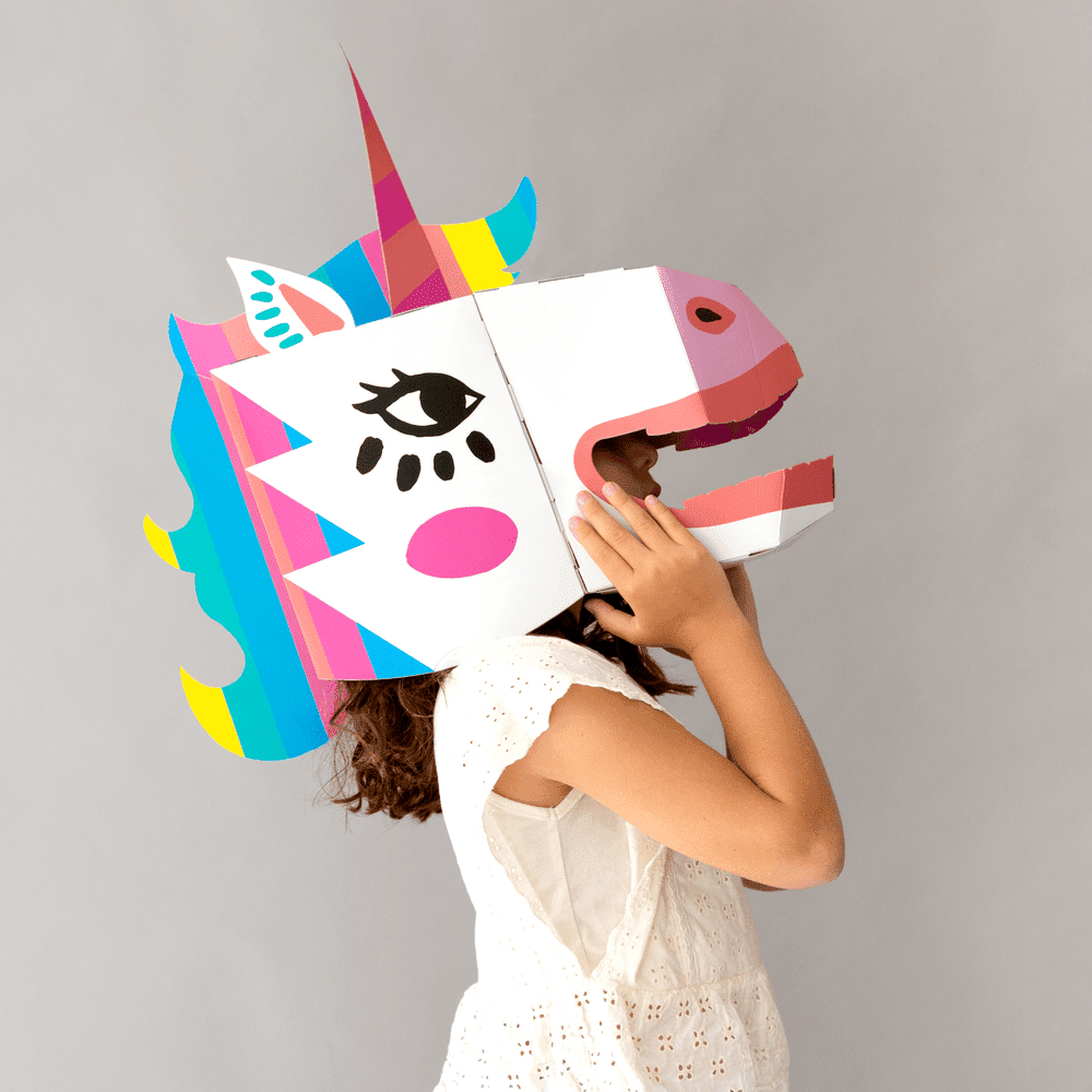 OMY Unicorn 3d mask on a child, vivid rainbow mane and white unicorn face in a playful costume moment.