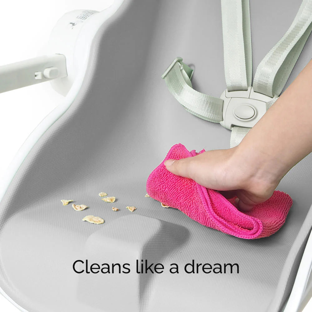 Oribel Cocoon Z high chair lounger in pink fabric being wiped clean