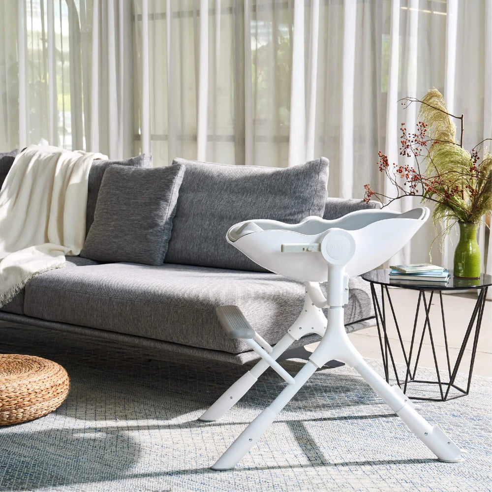 Oribel Cocoon Z high chair lounger, white plastic seat on an X-frame base in living room