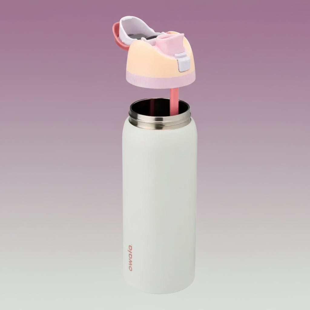 Owala FreeSip 32 oz Stainless Steel Water Bottle in Coastal Mist — removable lid and straw above the open stainless steel bottle