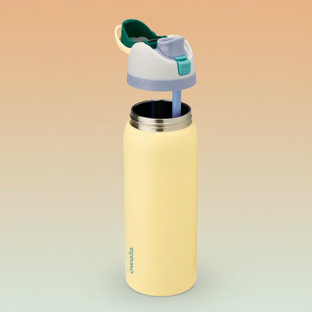 Yellow water bottle with a green and purple lid on a white background
