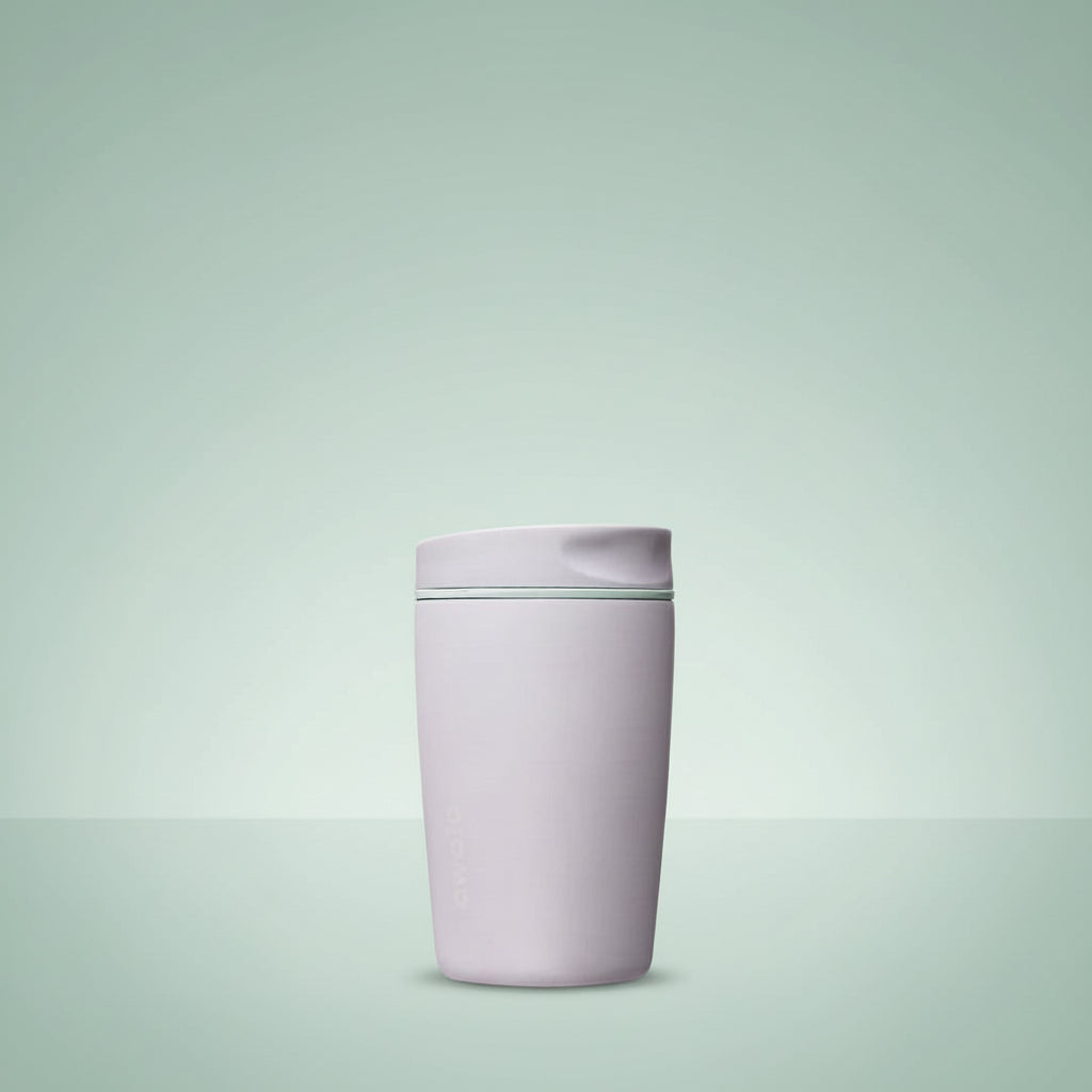 Light purple tumbler with a green accent on a white background
