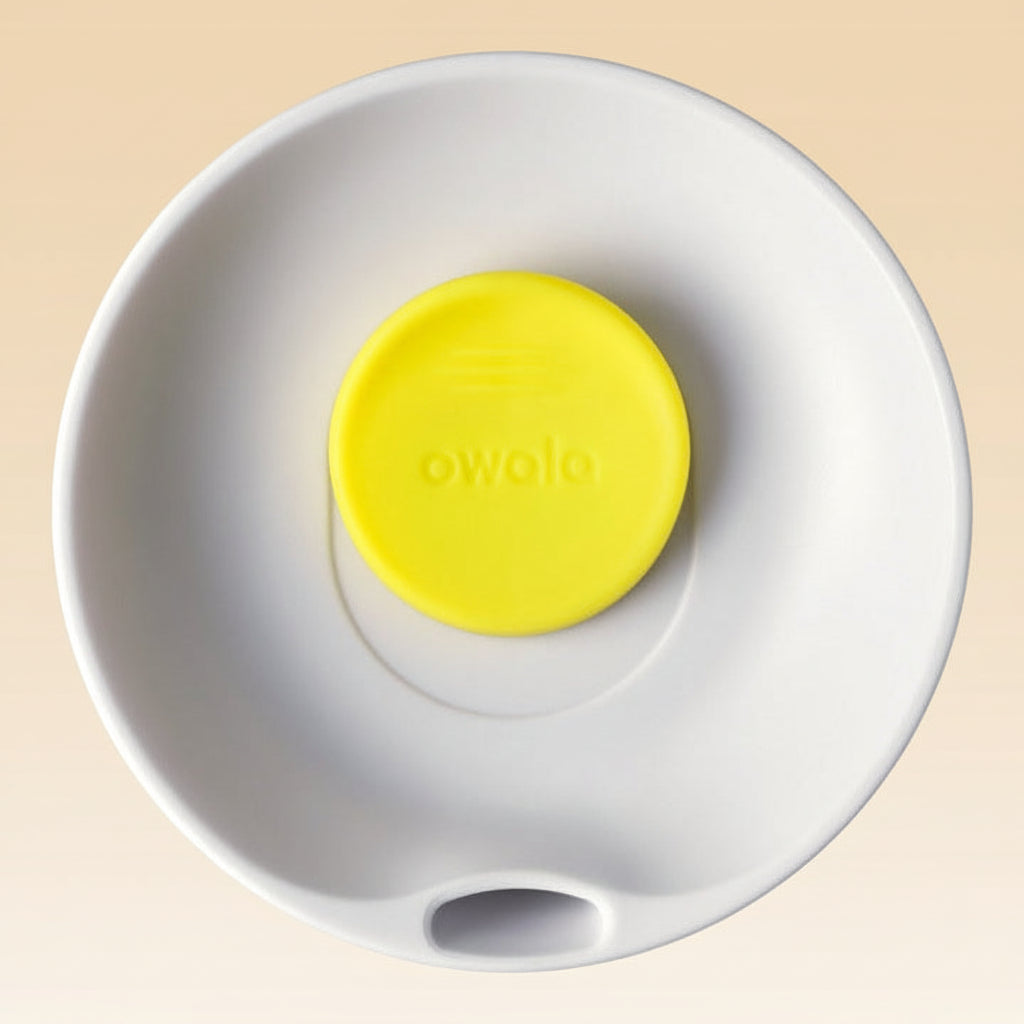 White ball with a yellow button featuring the brand 'owala' on a white background
