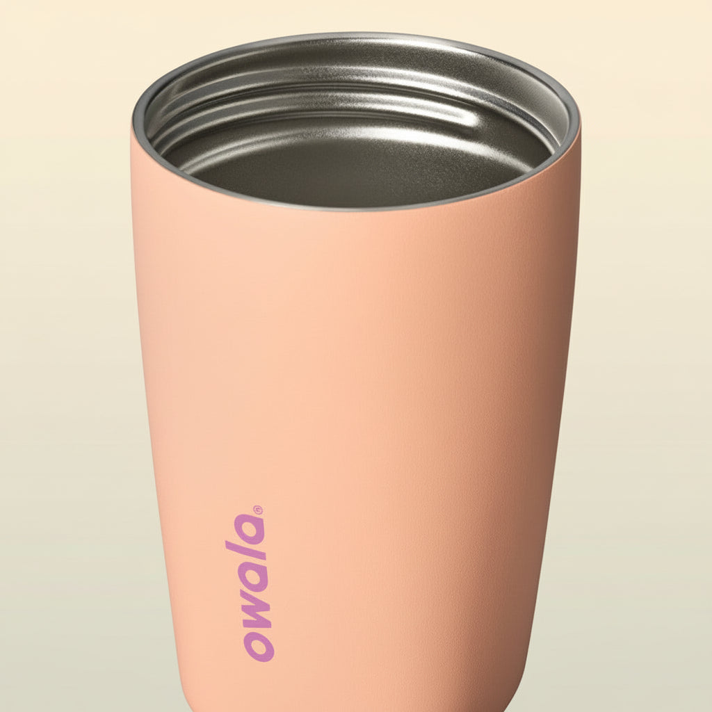 Pink insulated tumbler with white background