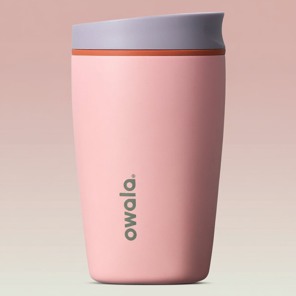 Pink tumbler with a purple lid on a white background