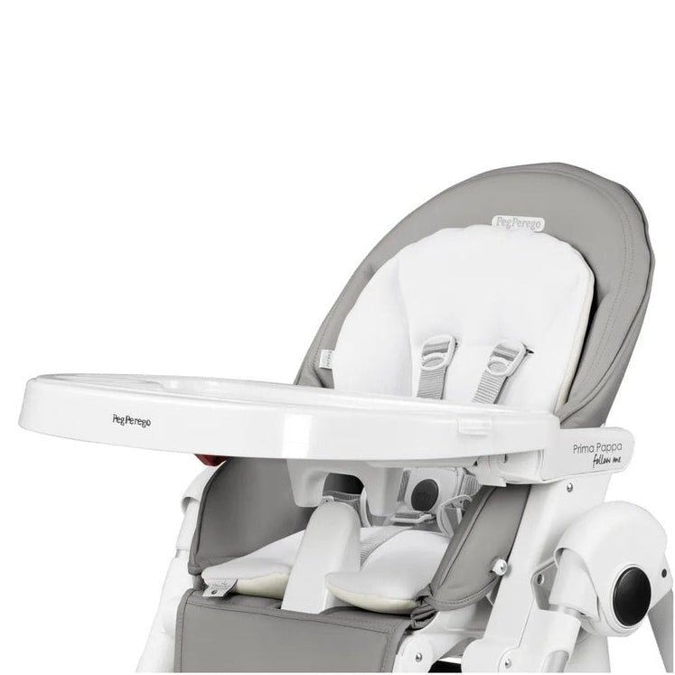 Peg Perego Booster Cushion on a white high chair frame with gray padding and safety harness.